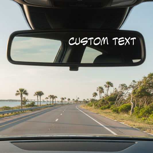 Car interior view with a road ahead and palm trees on a clear day, with 'CUSTOM TEXT' overlay.