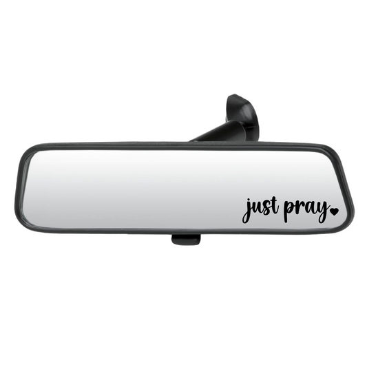 Car rearview mirror with 'just pray' text on a white background