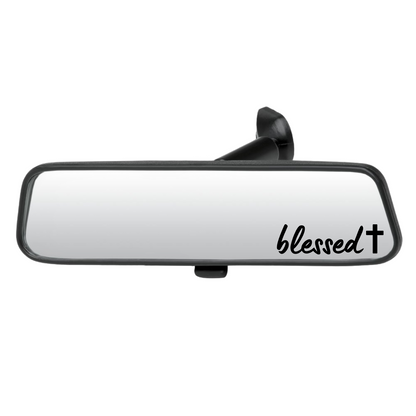 Car rearview mirror with 'blessed' text on a white background