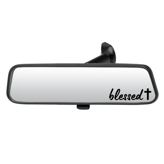Car rearview mirror with 'blessed' text on a white background